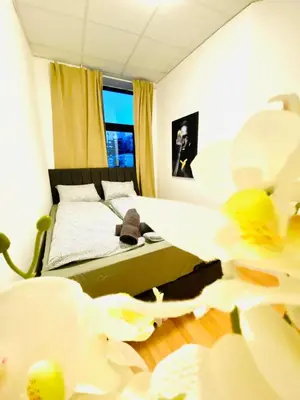 Ein Bett oder Betten in einem Zimmer der Unterkunft Comfortable Private Rooms in a Quiet, Well-Connected Area