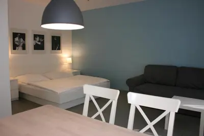 Ein Bett oder Betten in einem Zimmer der Unterkunft Storchencamp Gästehaus Purbach