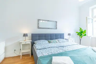 Ein Bett oder Betten in einem Zimmer der Unterkunft Stylish 1BR Apartment in Vienna, City Center
