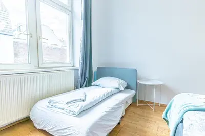 Ein Bett oder Betten in einem Zimmer der Unterkunft Stylish 1BR Apartment in Vienna, City Center