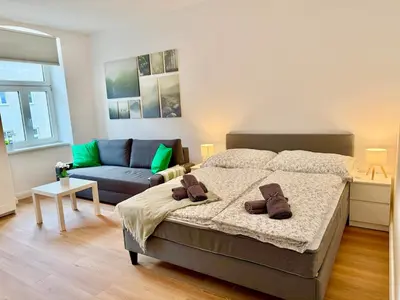 Ein Bett oder Betten in einem Zimmer der Unterkunft Modern Renovated Apartment