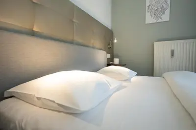 Ein Bett oder Betten in einem Zimmer der Unterkunft Studio with Queen-Size Bed K4