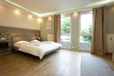 Ein Bett oder Betten in einem Zimmer der Unterkunft Studio with Queen-Size Bed K4