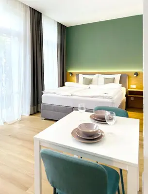 Ein Bett oder Betten in einem Zimmer der Unterkunft Villa Romana Apartments
