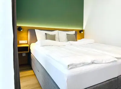 Ein Bett oder Betten in einem Zimmer der Unterkunft Villa Romana Apartments