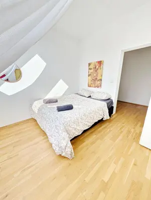 Ein Bett oder Betten in einem Zimmer der Unterkunft Lovely Rooms in Märzstraße Area MZ49