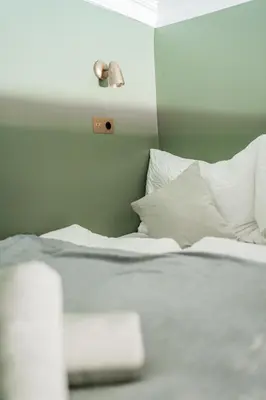 Ein Bett oder Betten in einem Zimmer der Unterkunft HOME1 - Jardin Boutique Hostel