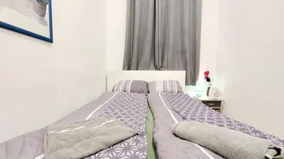 Ein Bett oder Betten in einem Zimmer der Unterkunft Comfortable rooms in Lugner City area HE