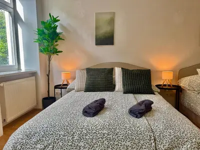 Ein Bett oder Betten in einem Zimmer der Unterkunft Cosy Central Long-Term Apartment