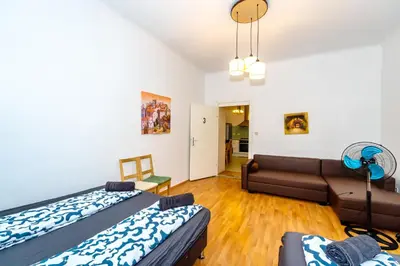 Ein Bett oder Betten in einem Zimmer der Unterkunft Family Rooms - 7 Minutes to Schönbrunn Palace