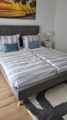 Ein Bett oder Betten in einem Zimmer der Unterkunft Lakeside Ferienhaus - Parndorf Outlet