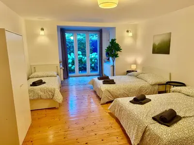 Ein Bett oder Betten in einem Zimmer der Unterkunft Luxury 130 m2 Apartment with Garden