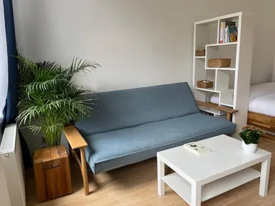 Ein Sitzbereich in der Unterkunft Long-Term Central Charming Apartment
