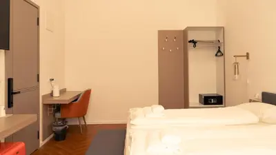 Ein Bett oder Betten in einem Zimmer der Unterkunft Elias Residence Vienna