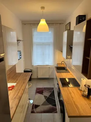 Küche/Küchenzeile in der Unterkunft A stylish and comfortable 2 bedroom apartment with thoughtful design, private balcony, and a relaxing bathtub, making it perfect for well being and cozy city living