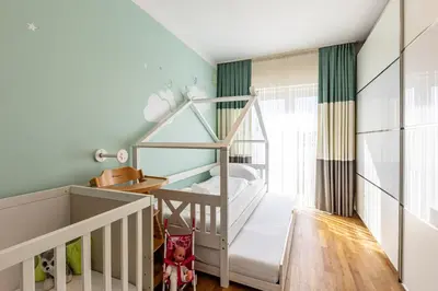Ein Bett oder Betten in einem Zimmer der Unterkunft Family & Luxury by JR City Apartments