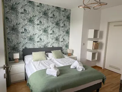 Ein Bett oder Betten in einem Zimmer der Unterkunft Traumhafte Terrassen Wohnung am Wienerberg