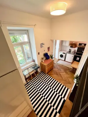 Ein Bett oder Betten in einem Zimmer der Unterkunft Stylish Central Apartment with Balcony