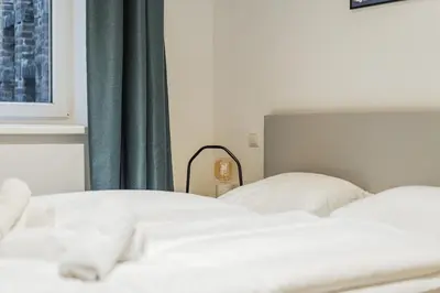 Ein Bett oder Betten in einem Zimmer der Unterkunft Apartment with Stylish Décor & Welcoming Flair
