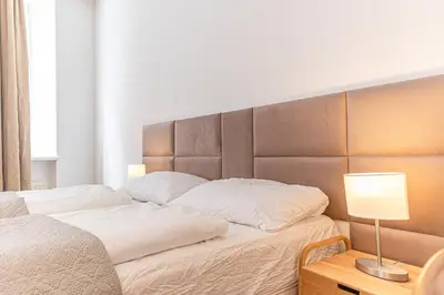 Ein Bett oder Betten in einem Zimmer der Unterkunft 3BR Apartment with Nice Location in Vienna For Long Stays
