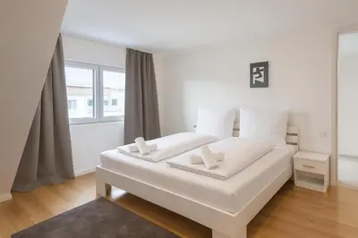 Ein Bett oder Betten in einem Zimmer der Unterkunft Céleste Suites