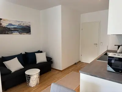 Ein Sitzbereich in der Unterkunft Modern City Apartment with private Garden