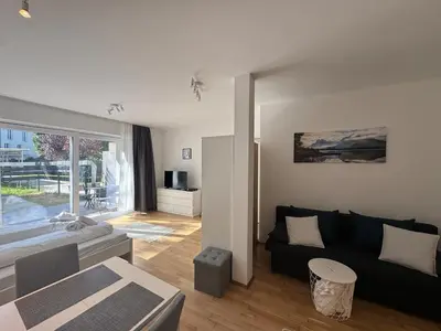 Ein Sitzbereich in der Unterkunft Modern City Apartment with private Garden