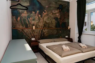 Ein Bett oder Betten in einem Zimmer der Unterkunft Residence K | Design Studio in Historic Townhouse