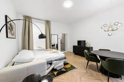 Ein Bett oder Betten in einem Zimmer der Unterkunft Luxury Westbahnhof Suites Vienna by FLEXIFLATS