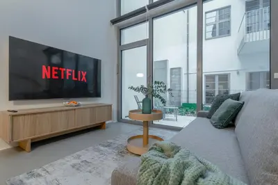 TV/Unterhaltungsangebot in der Unterkunft Bauhaus-Loft - Garten mit Terrasse - 20min zu Wien Mitte - Smart TV