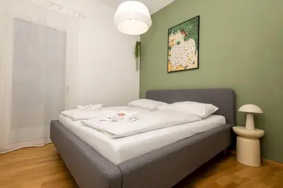 Ein Bett oder Betten in einem Zimmer der Unterkunft Modern apartment with garden & top connection