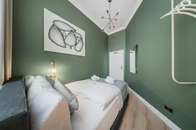 Ein Bett oder Betten in einem Zimmer der Unterkunft HOME1 - Belvedere Boutique Hostel