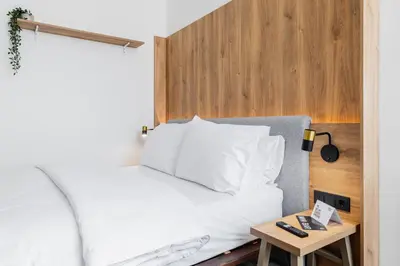 Ein Bett oder Betten in einem Zimmer der Unterkunft FortyPlusOne Apartments Vienna