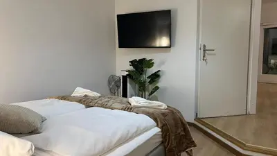 Ein Bett oder Betten in einem Zimmer der Unterkunft Lovely 3BR Apartment with Balcony near Rennweg station