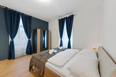 Ein Bett oder Betten in einem Zimmer der Unterkunft Nüll Residences 13 - 2 Bedrooms close to main station