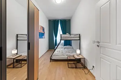 Ein Bett oder Betten in einem Zimmer der Unterkunft Nüll Residences 19 - Modern Flat for 4 Guests