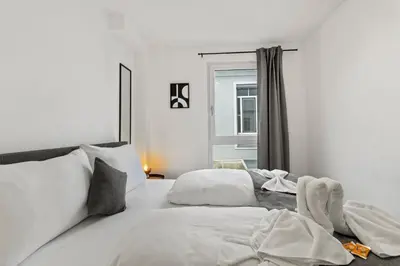 Ein Bett oder Betten in einem Zimmer der Unterkunft NobleNest Grand - Kaffeevollautomat - Terrasse