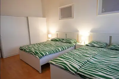Ein Bett oder Betten in einem Zimmer der Unterkunft Cosy Apartment near Center