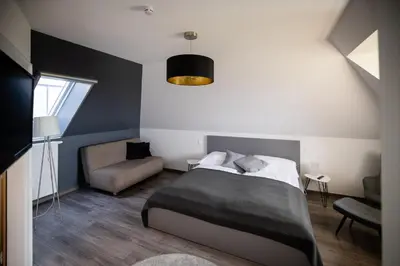 Ein Bett oder Betten in einem Zimmer der Unterkunft Strommer wine das Gästehaus