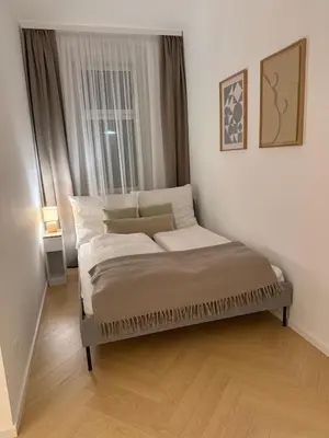 Ein Bett oder Betten in einem Zimmer der Unterkunft Modern ausgestattete Wohnung mit Wiener Charme