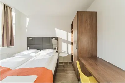 Ein Bett oder Betten in einem Zimmer der Unterkunft Central Apartment near Metro