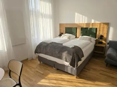 Ein Bett oder Betten in einem Zimmer der Unterkunft Stylish 1BR Apartment Wiener Stadthalle