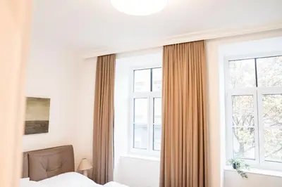 Ein Bett oder Betten in einem Zimmer der Unterkunft Cozy Central Vienna