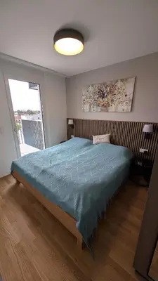 Ein Bett oder Betten in einem Zimmer der Unterkunft Fountain Suite Vienna - Garage, U-Bahn Nähe