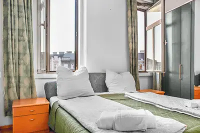 Ein Bett oder Betten in einem Zimmer der Unterkunft Comfortable 2BR Apartment Near Millennium Tower Long Stay