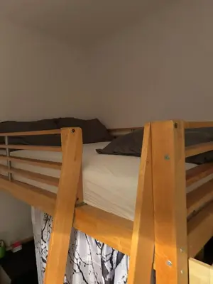 Ein Bett oder Betten in einem Zimmer der Unterkunft Małe M