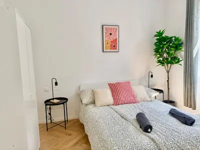 Ein Bett oder Betten in einem Zimmer der Unterkunft Renovated Stylish Apartment