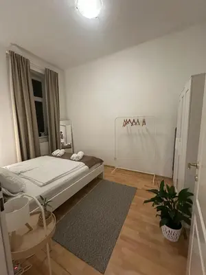 Ein Bett oder Betten in einem Zimmer der Unterkunft Viennese Nest Apartment