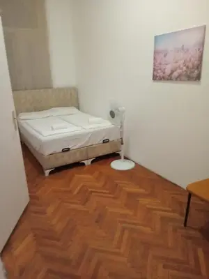 Ein Bett oder Betten in einem Zimmer der Unterkunft City Residence Home