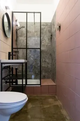 Ein Badezimmer in der Unterkunft LAROGYs APARTMENTS